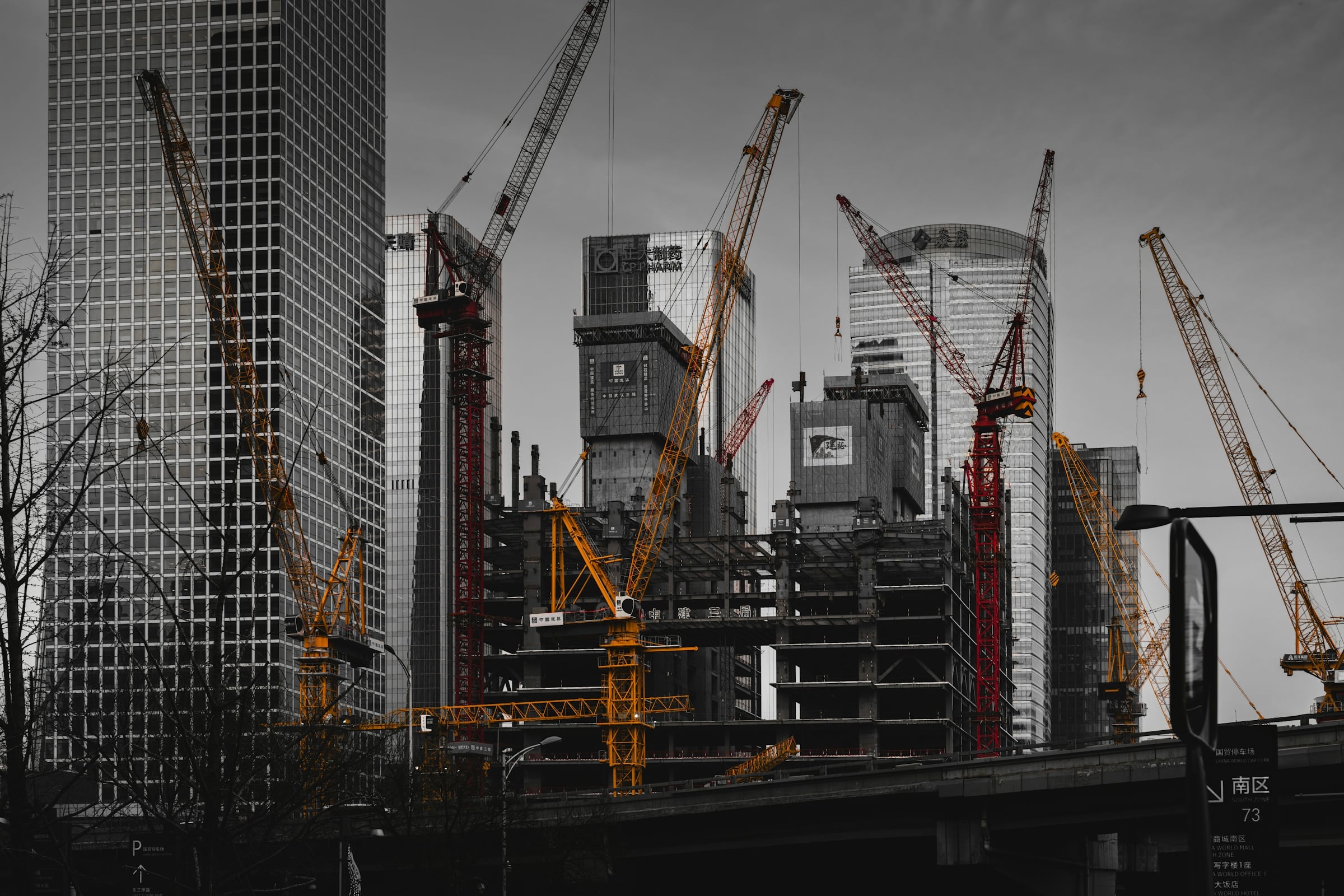 Steel reinforcing bars and scaffolding on an unfinished multi-storey construction site