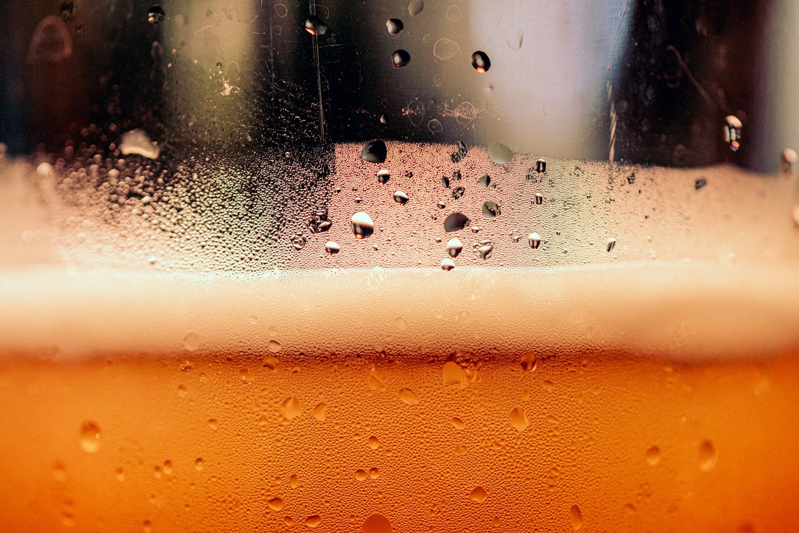 Close-up of a cold glass of craft beer with condensation