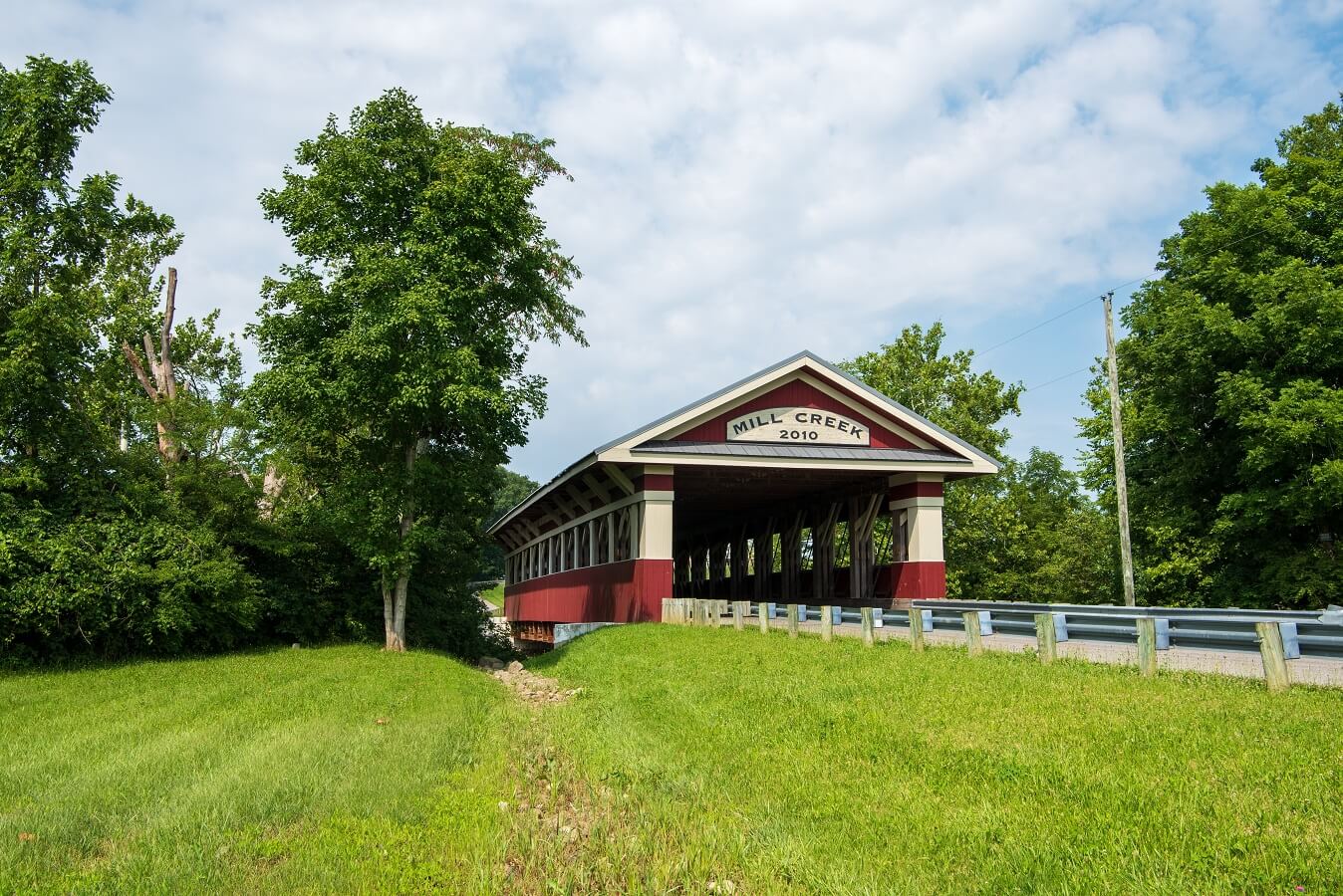 the two-lane Thompson Road Covered Bridge spans