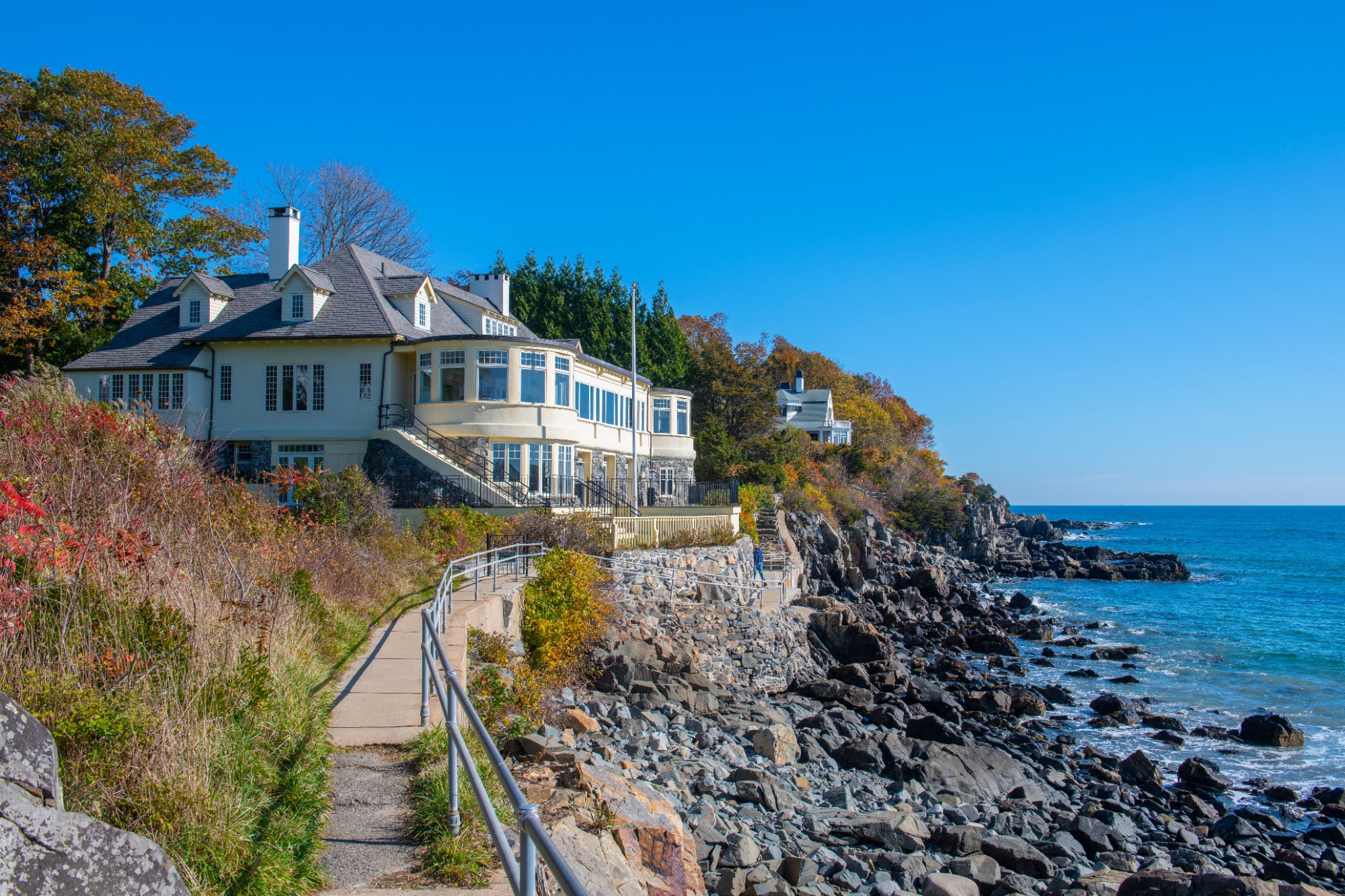 Historic mansion on Cliff Walk in fall at York Harbor Beach in village of York Harbor, town of York, Maine ME, USA.