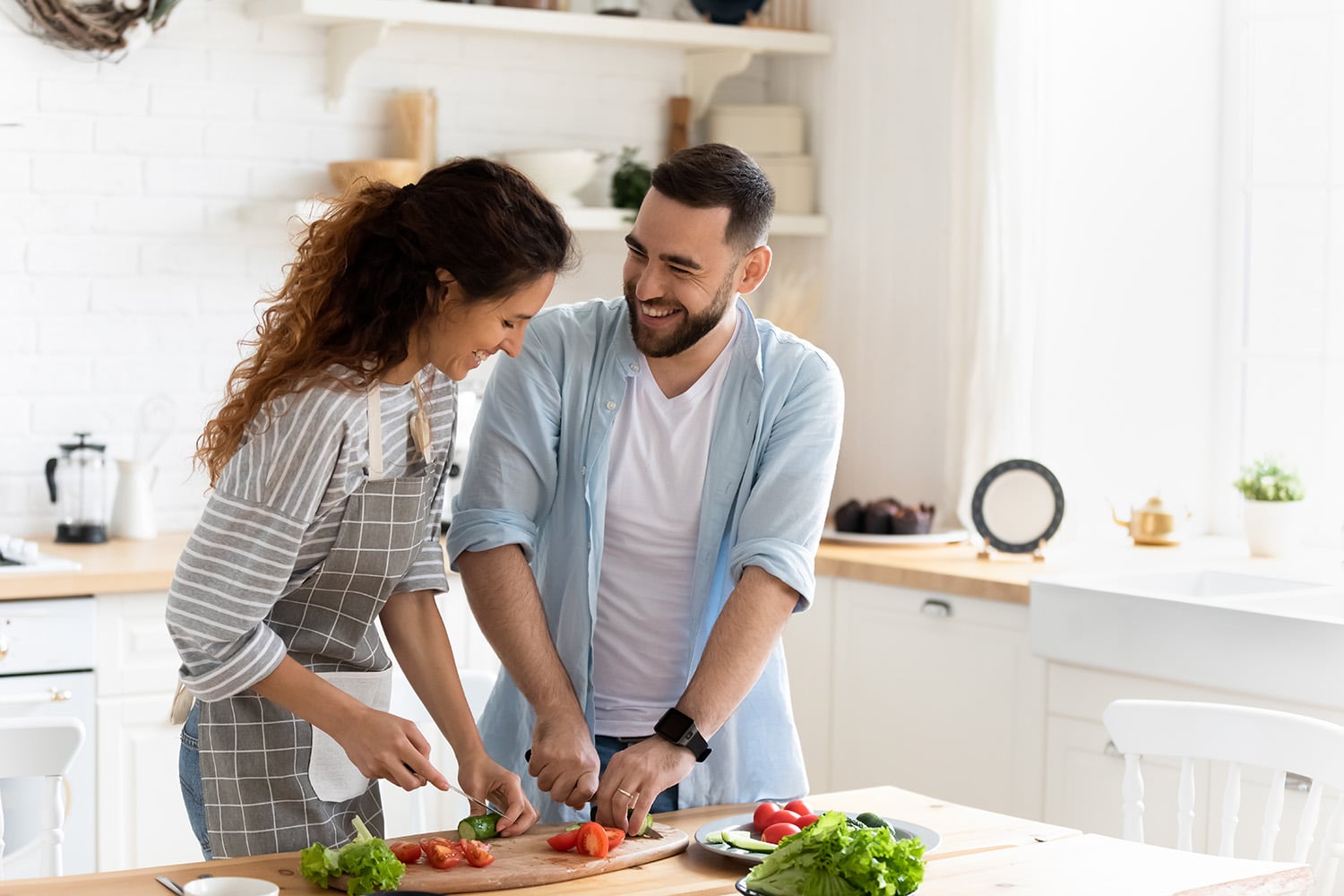 Happy,Couple,Standing,In,Kitchen,At,Home,Preparing,Together,Yummy