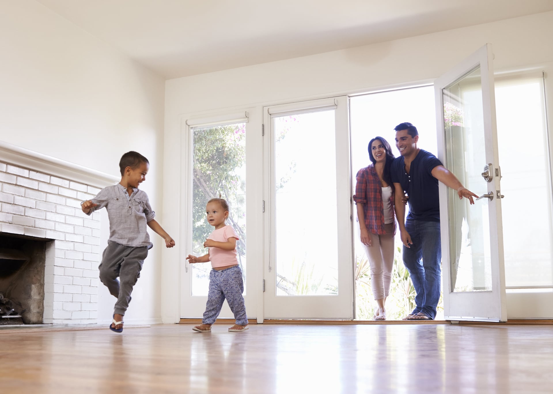 Excited-Family-Explore-New-Home-On-Moving-Day