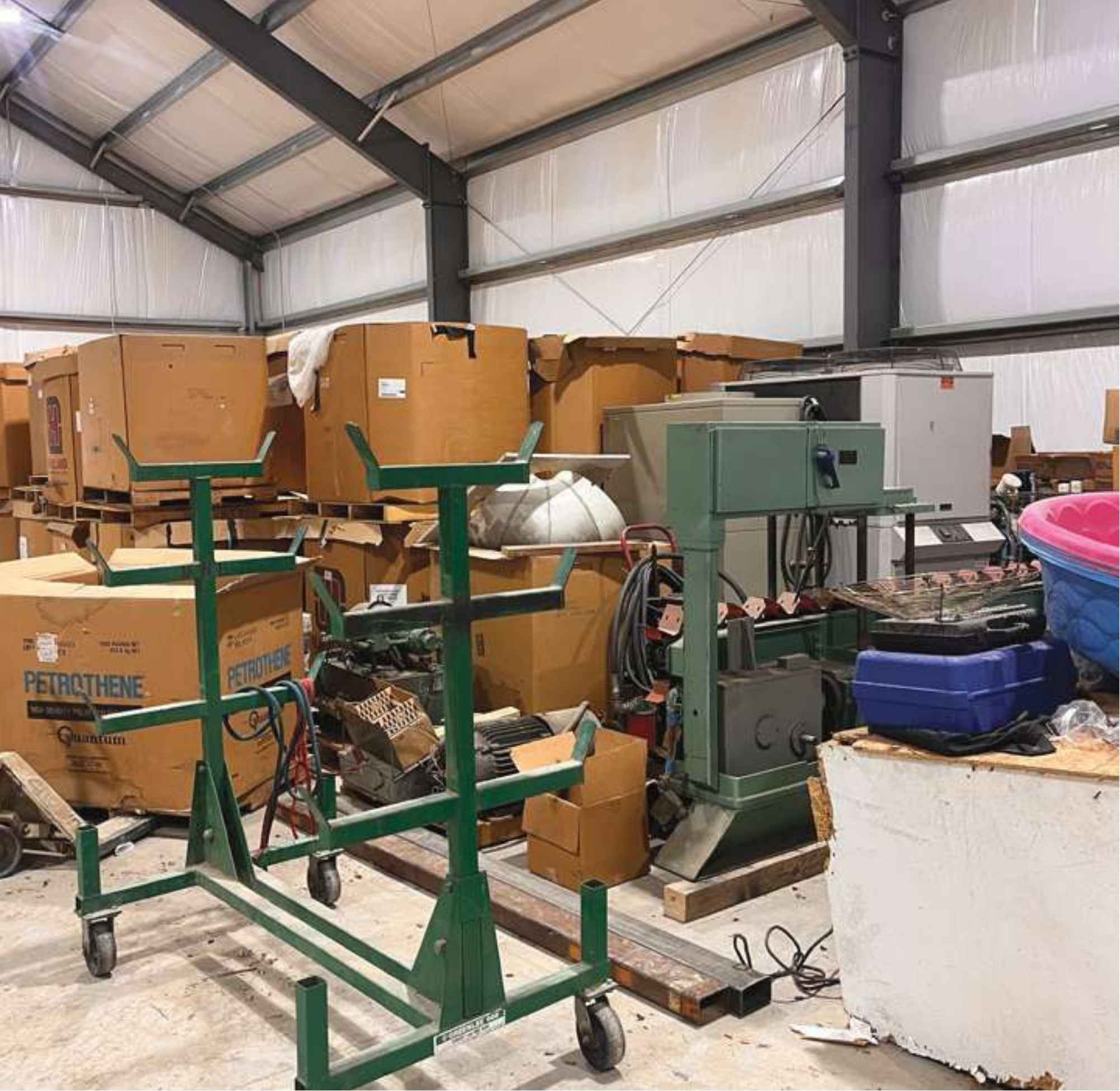 Manufacturing equipment stored inside the outbuilding before removal