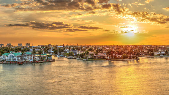 Marco Island - Golden sky over City Lights across Factory Bay in Marco Island, Florida