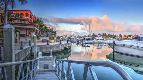 Marco Island - Sunrise over the boats in Esplanade Harbor Marina in Marco Island, Florida