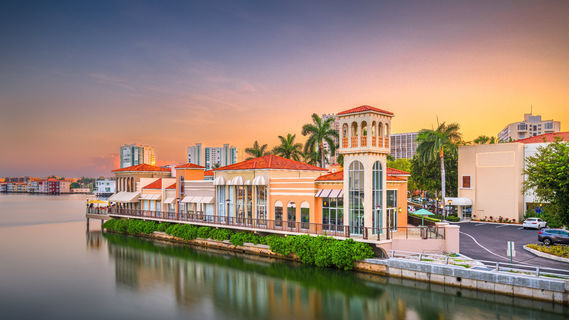 Naples - Naples, Florida, USA downtown cityscape on the bay at dusk