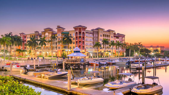Naples - Naples, Florida, USA town skyline on the water at dawn 02
