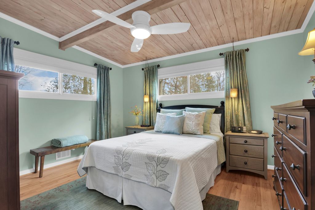  Inside, the bedrooms are warm with wood floors, tongue-and-groove ceilings and plenty of closet space. The downstairs den has a newer gas fireplace that will literally warm up the entire house!!