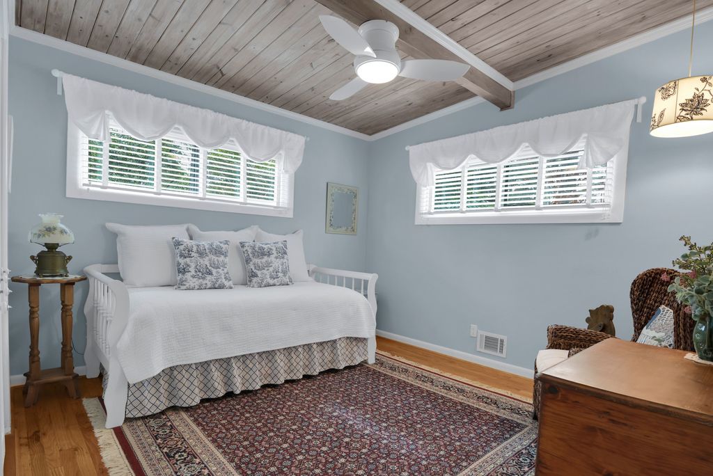  Inside, the bedrooms are warm with wood floors, tongue-and-groove ceilings and plenty of closet space. The downstairs den has a newer gas fireplace that will literally warm up the entire house!!