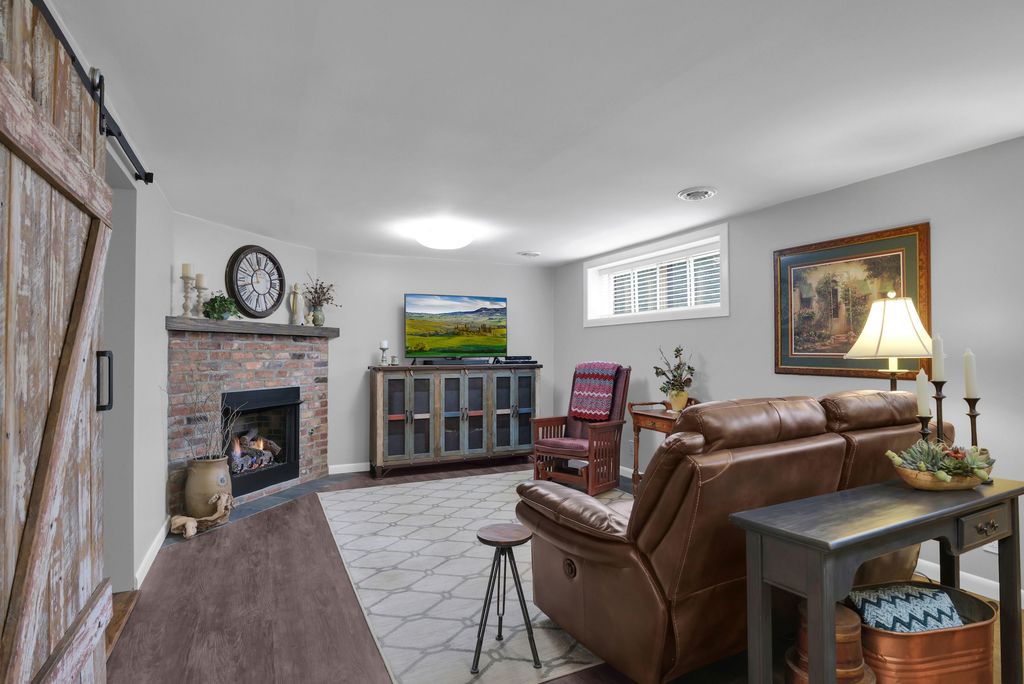  Inside, the bedrooms are warm with wood floors, tongue-and-groove ceilings and plenty of closet space. The downstairs den has a newer gas fireplace that will literally warm up the entire house!!