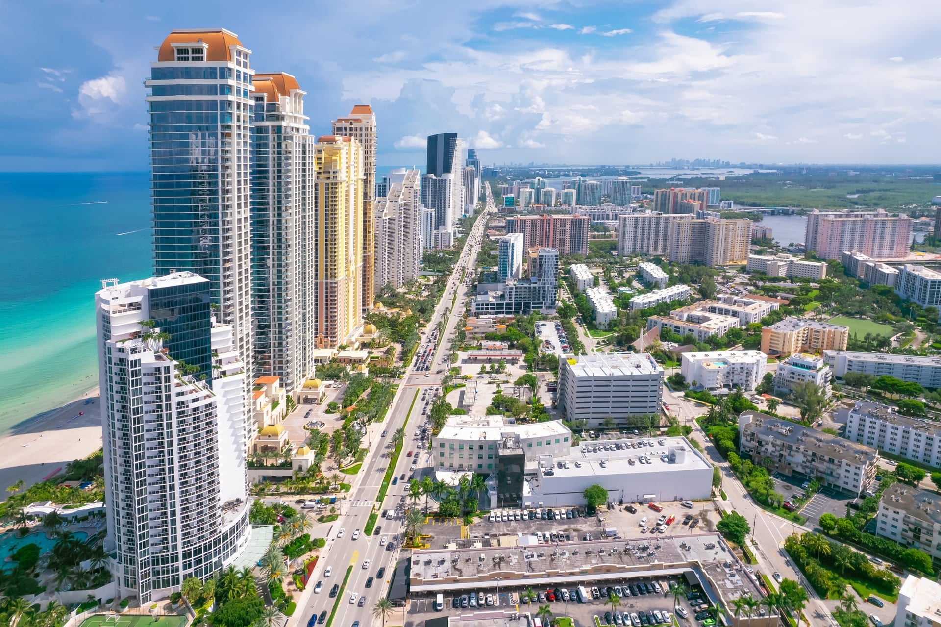 Sunny Isles Beach Florida. Panorama of Miami Beach FL. Atlantic Ocean beach. Beautiful seascape. Turquoise color of sea water. Summer vacation in Florida. Aerial view on Hotels and Resorts on Island
