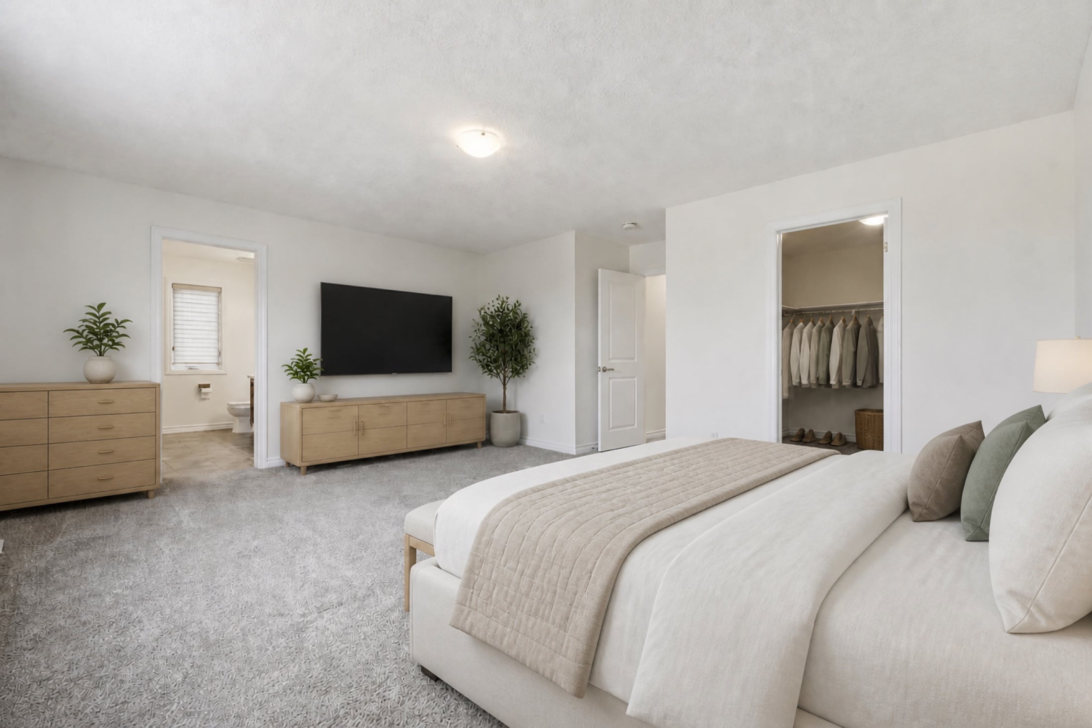 Virtually staged primary bedroom showing ensuite and walk-in closet access
