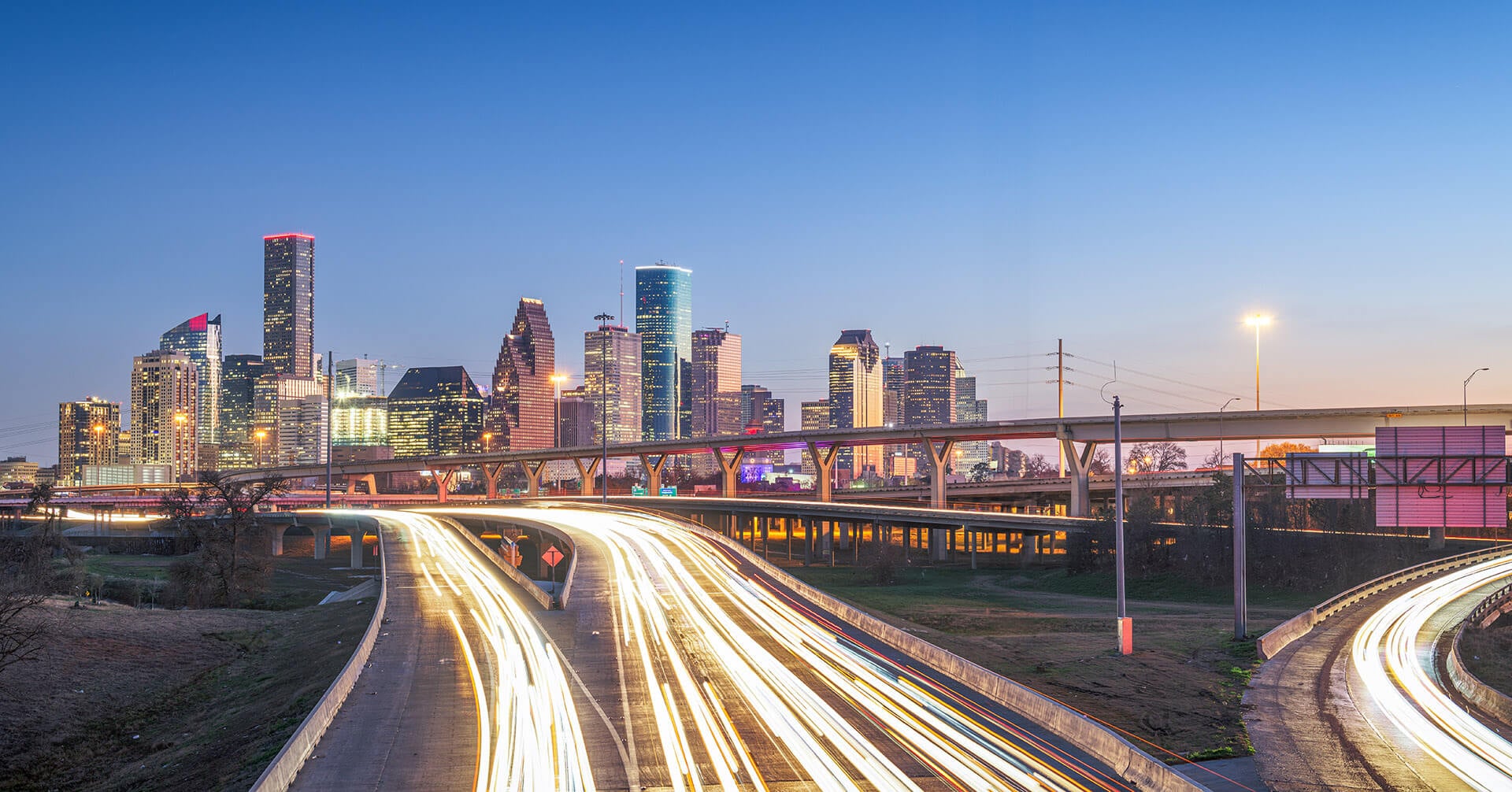 Houston, Texas, USA downtown skyline over the highways at dusk.