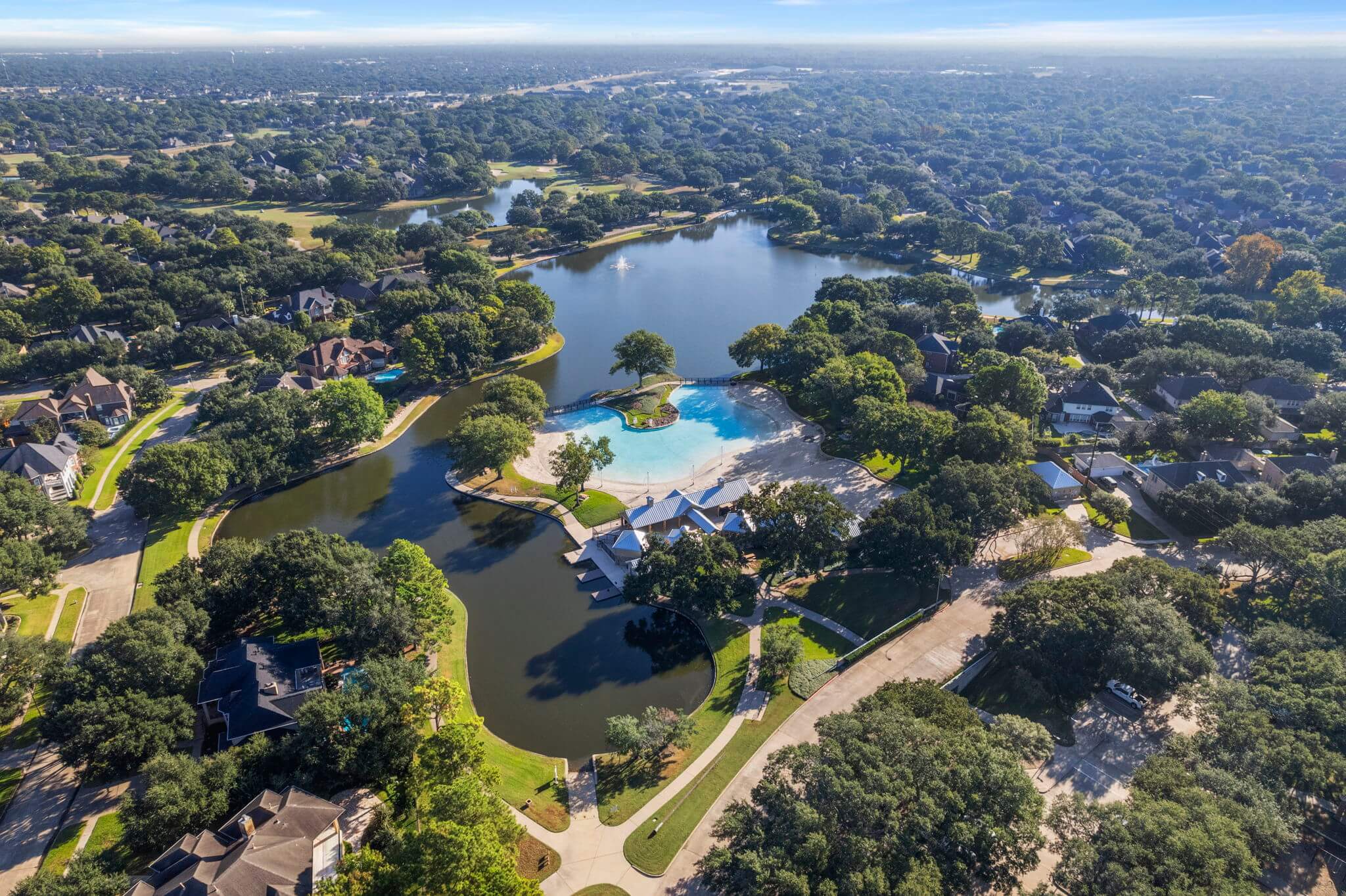 Aerial view of houses and artificial lake, suburbs of Houston, Texas