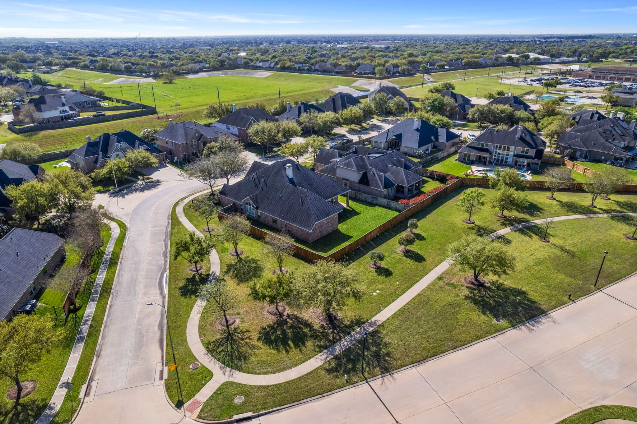 Aerial view of houses and green spaces, Katy, Texas
