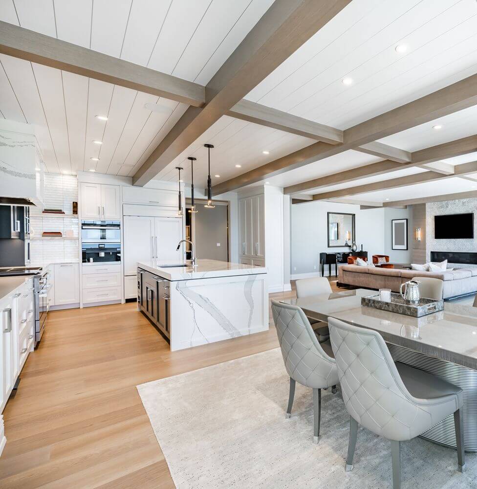 Luxurious high end kitchen with stainless appliances marble and glass tile