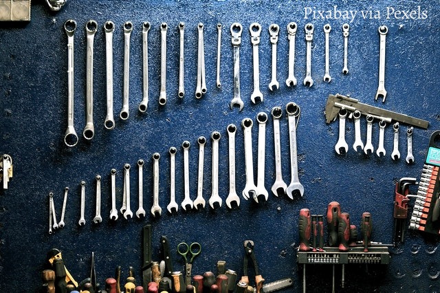 automotive tools hanging on a wall