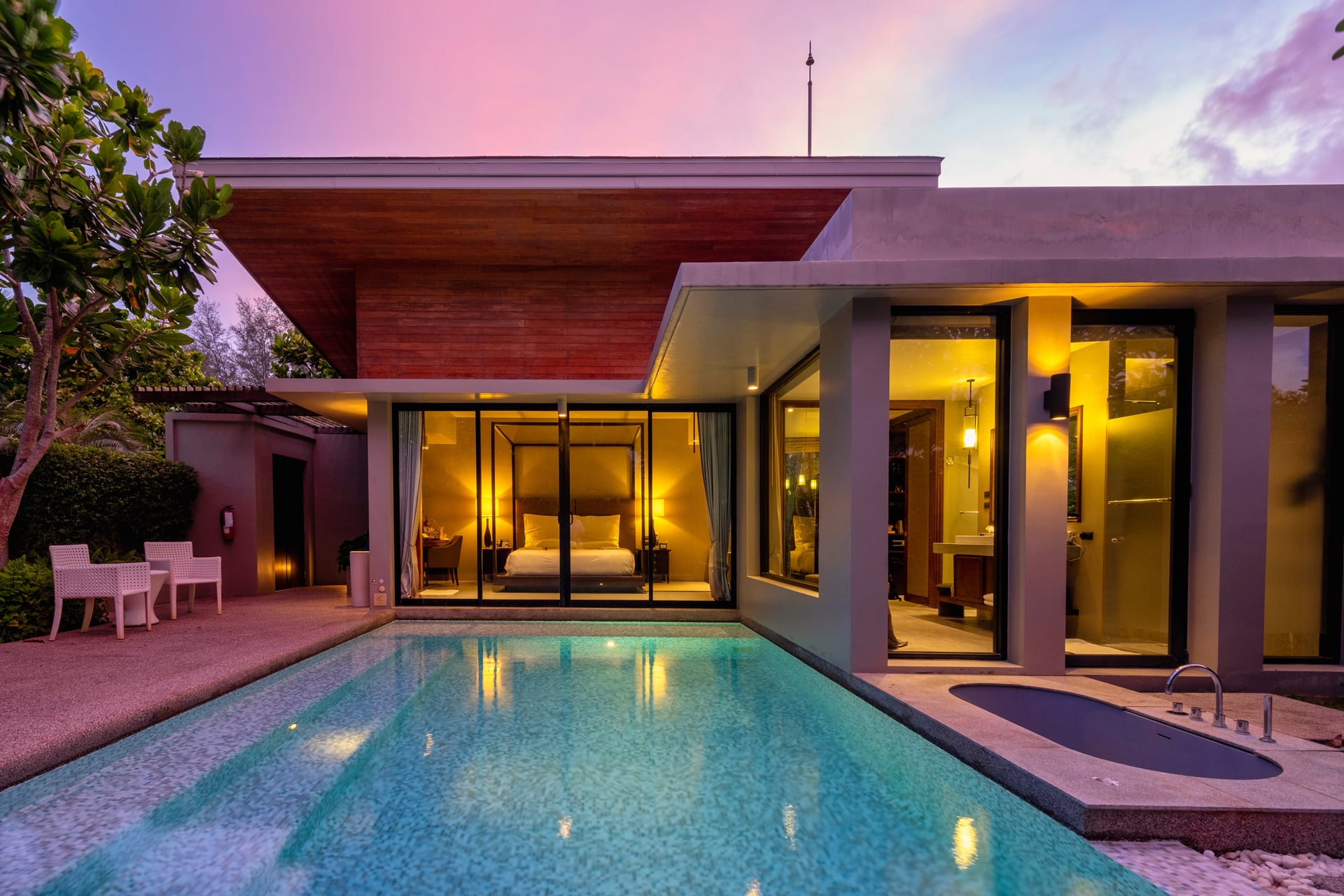 Modern-house-with-a-swimming-pool,-modern-pool-villa-at-the-beach,-luxury-villa