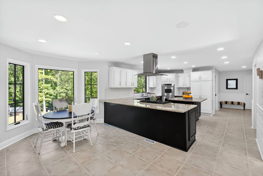 Open kitchen at 106 Riverbank Ct in Moore SC with large island, breakfast nook, and natural light