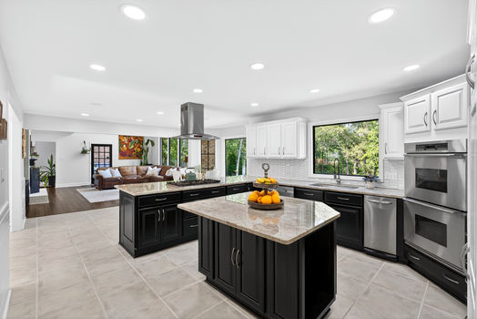 Open concept kitchen and living area at 106 Riverbank Ct in Moore SC with large island and natural light