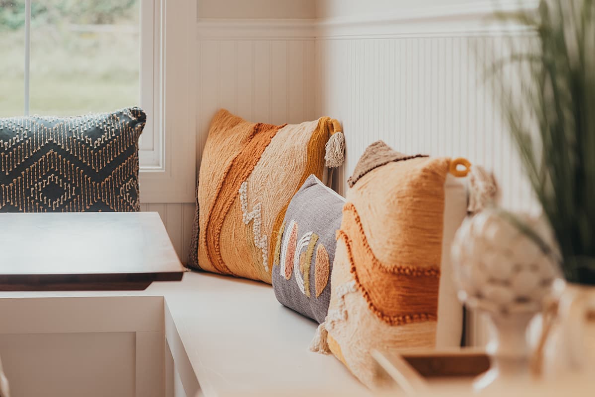 Wooden Bench with decorative pilows in Rochester, NY house (1)