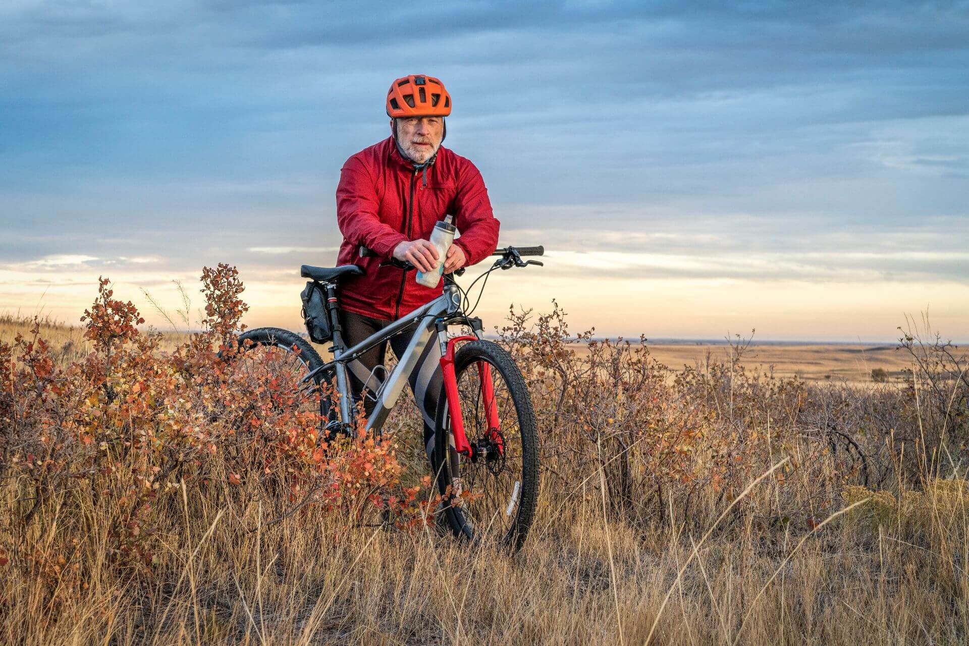 Senior cyclist is riding mountain bike in Colorado prairie Soapstone Prairie Natural Area