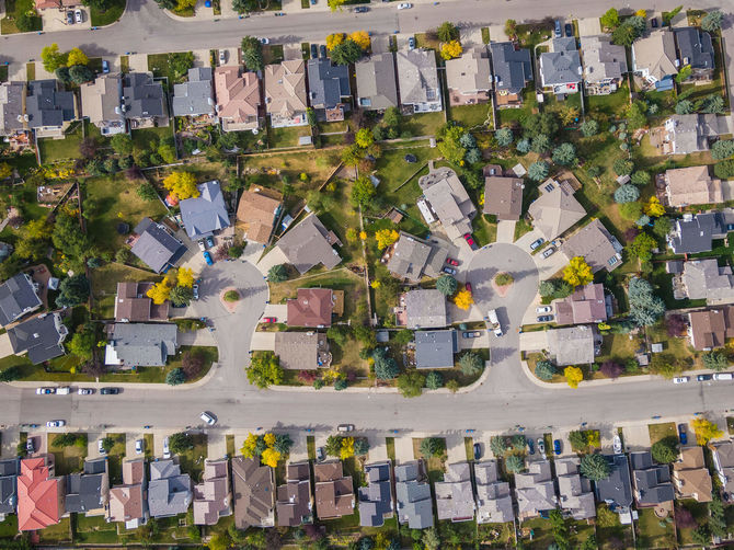 Aerial top down view of houses in beautiful residential neighbourhood during fall season in Calgary, Alberta, Canada.