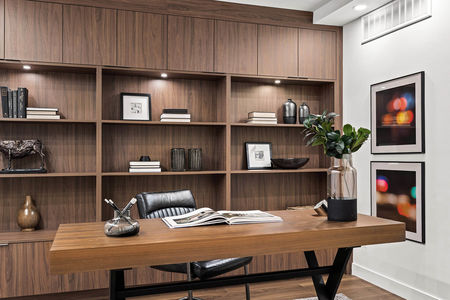 s105, 330 26 Ave SW, Canada interior home. Desk with big wood library
