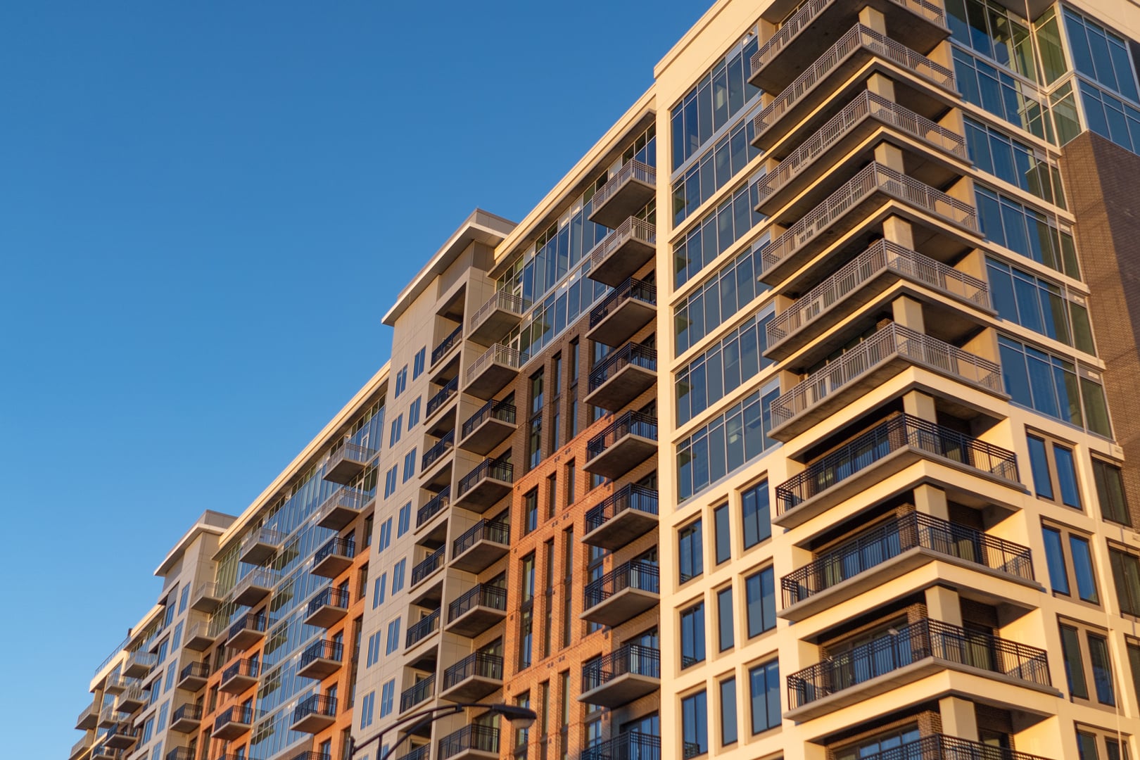Modern-apartment-building-on-blue-sky-at-sunrise