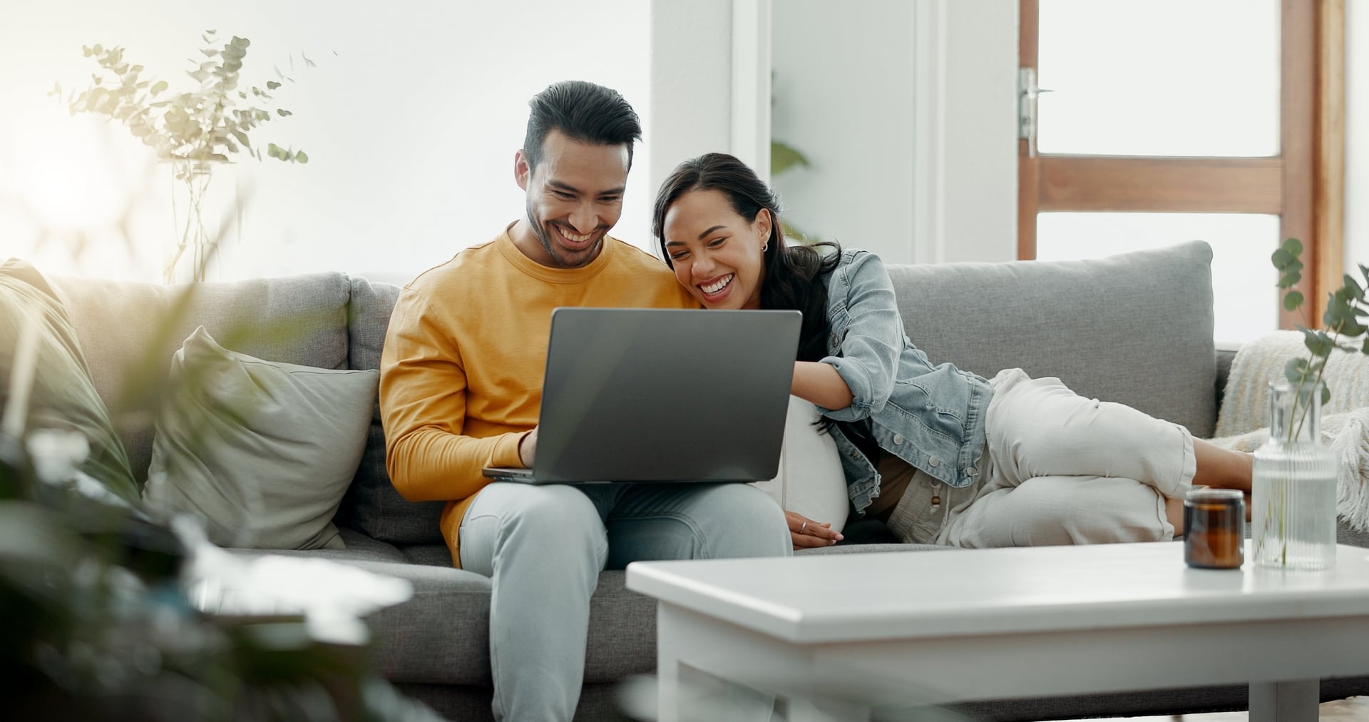 Couple,,Laptop,And,Laugh,On,Sofa,In,Home,For,Meme,