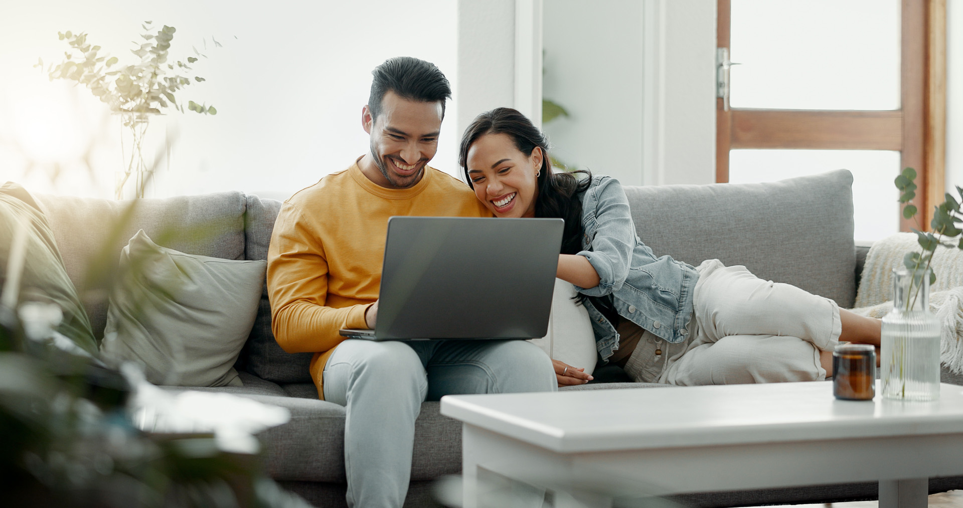 Couple,,Laptop,And,Laugh,On,Sofa,In,Home,For,Meme,