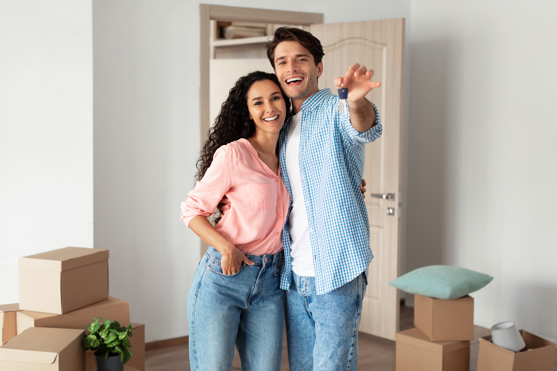 House,Ownership.,Portrait,Of,Happy,Young,Couple,Holding,Showing,Key
