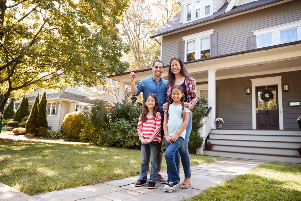 Portrait-Of-Family-Holding-Keys