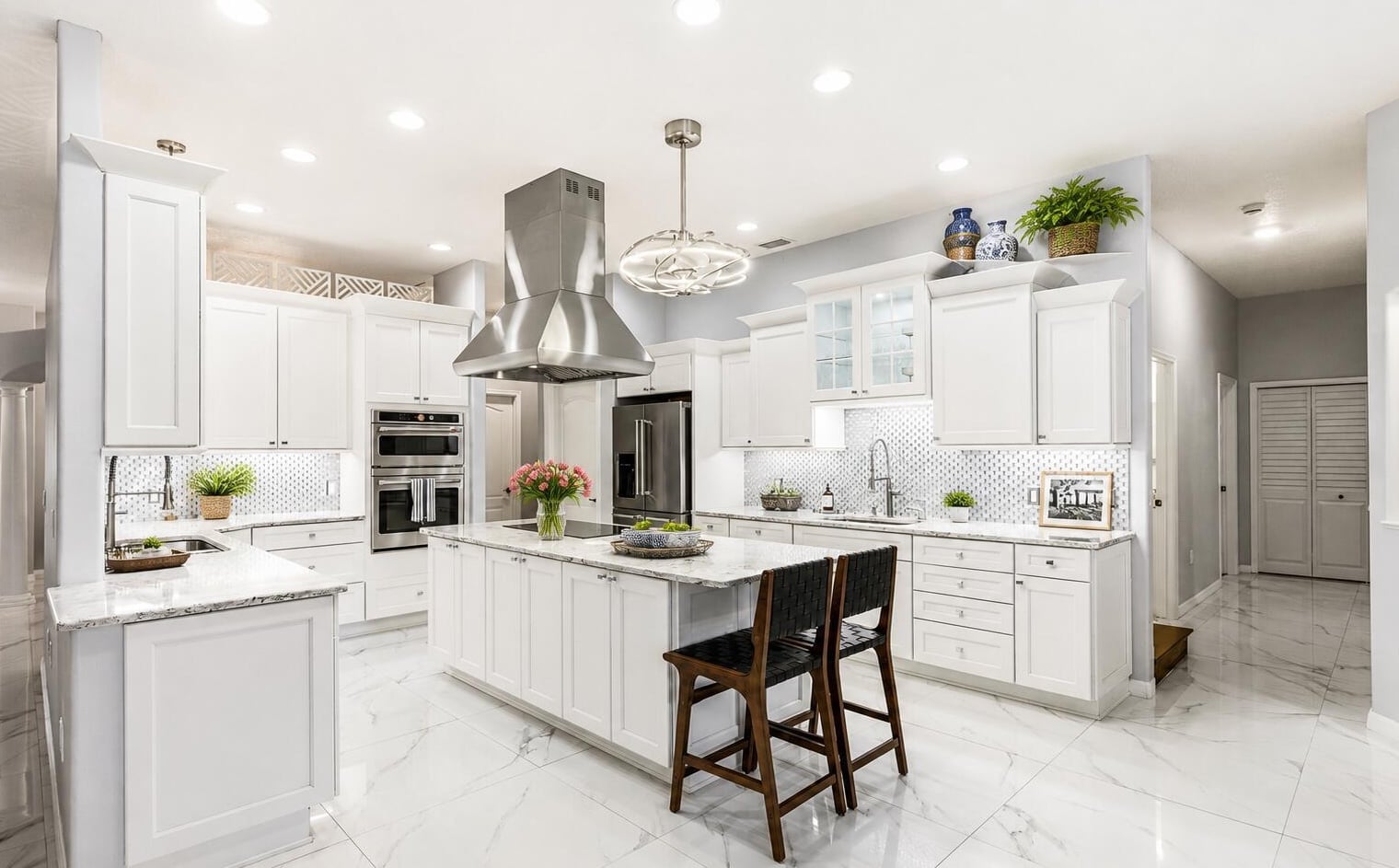 Open chef's kitchen with nine-foot quartz island at 3130 Southern Oaks Drive Merritt Island Florida