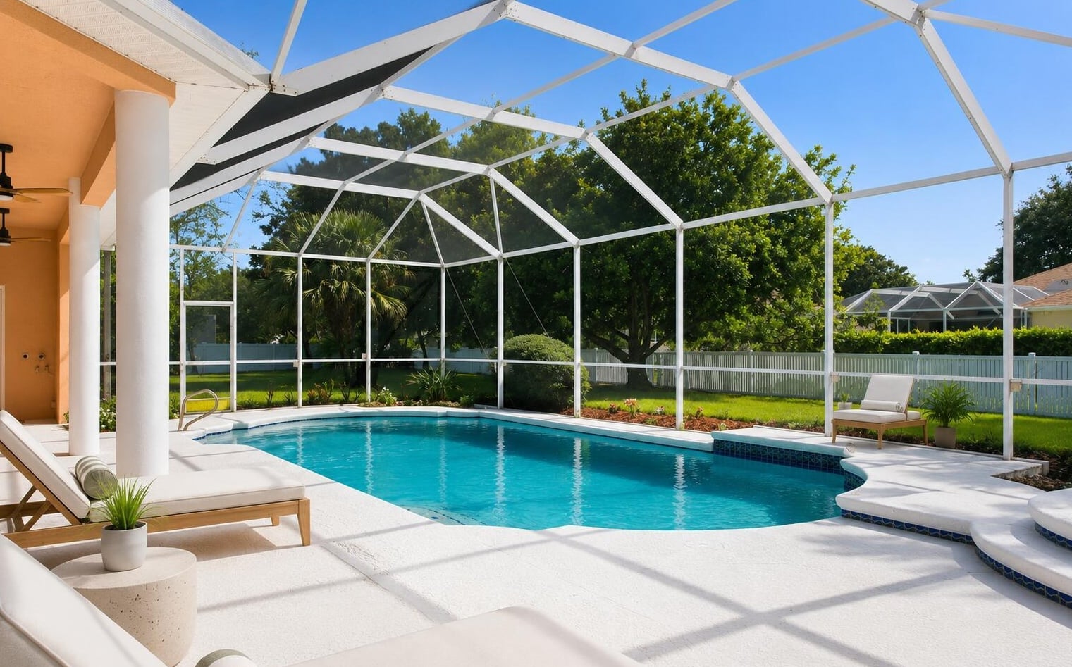 Screened swimming pool summer kitchen and outdoor living at 3130 Southern Oaks Drive South Merritt Island Florida