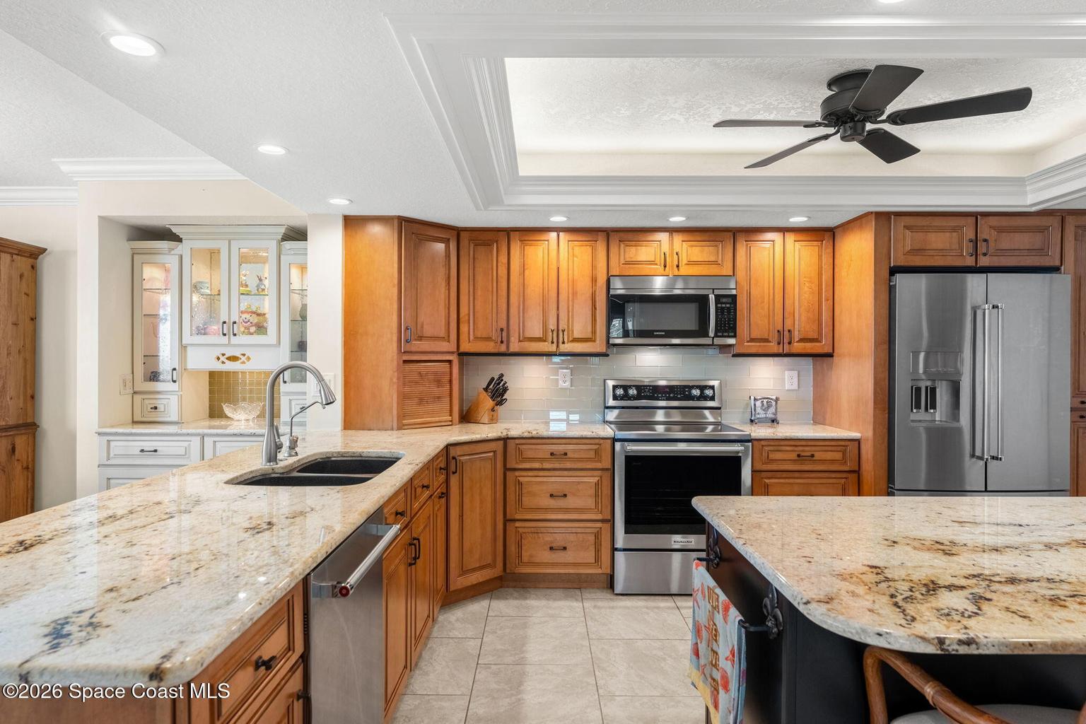 Granite kitchen inside 1835 S Atlantic Ave 301 Cocoa Beach oceanfront condo