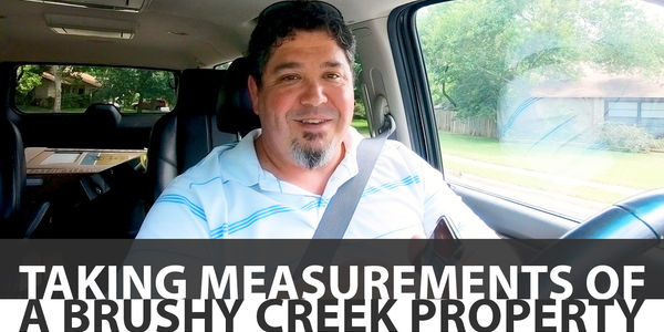 Taking Measurements of a Brushy Creek Property