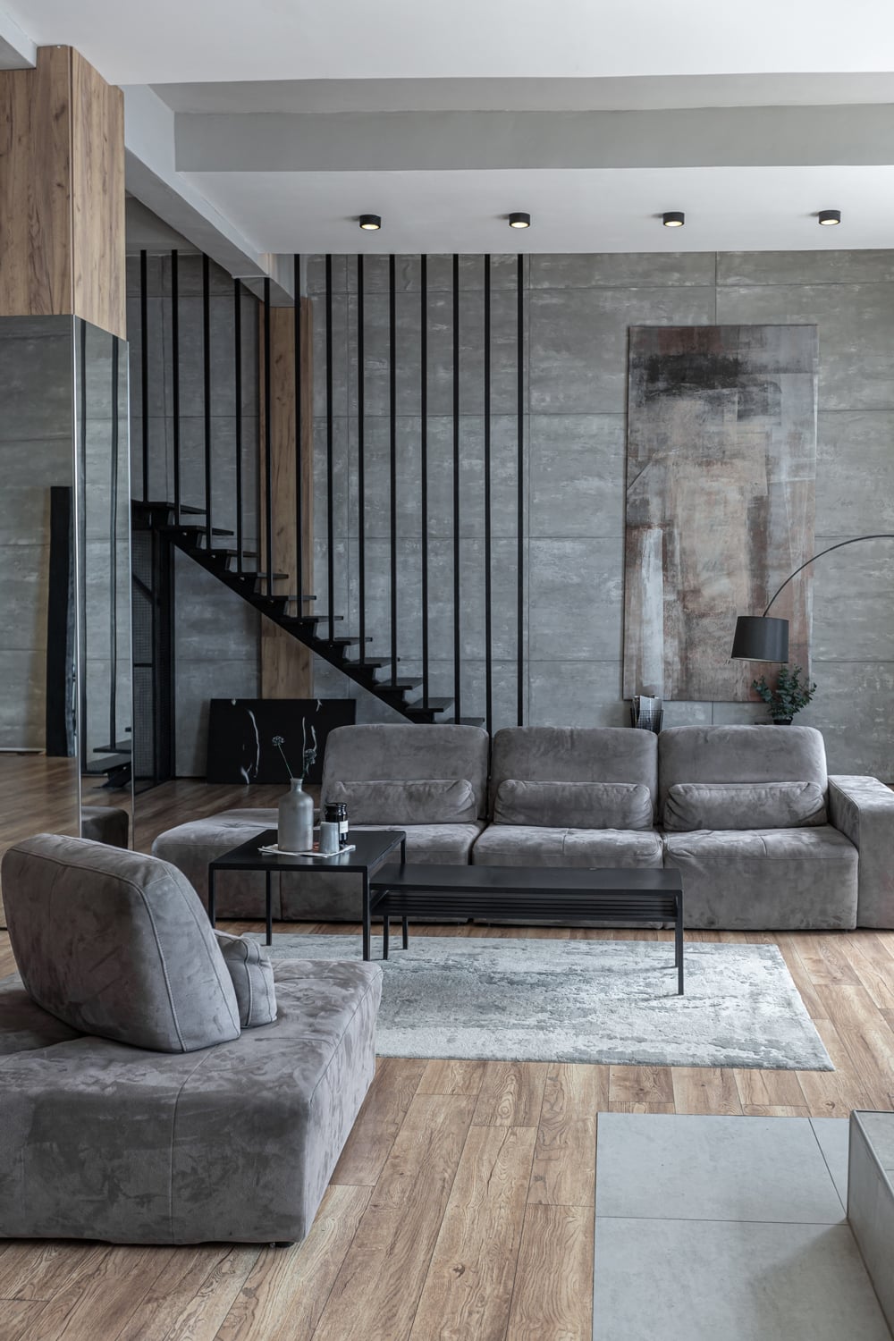 stylish-minimalistic-restrained-modern-interior-of-a-two-storey-apartment-without-people-in-the-daytime-in-loft-style-in-gray-tones.