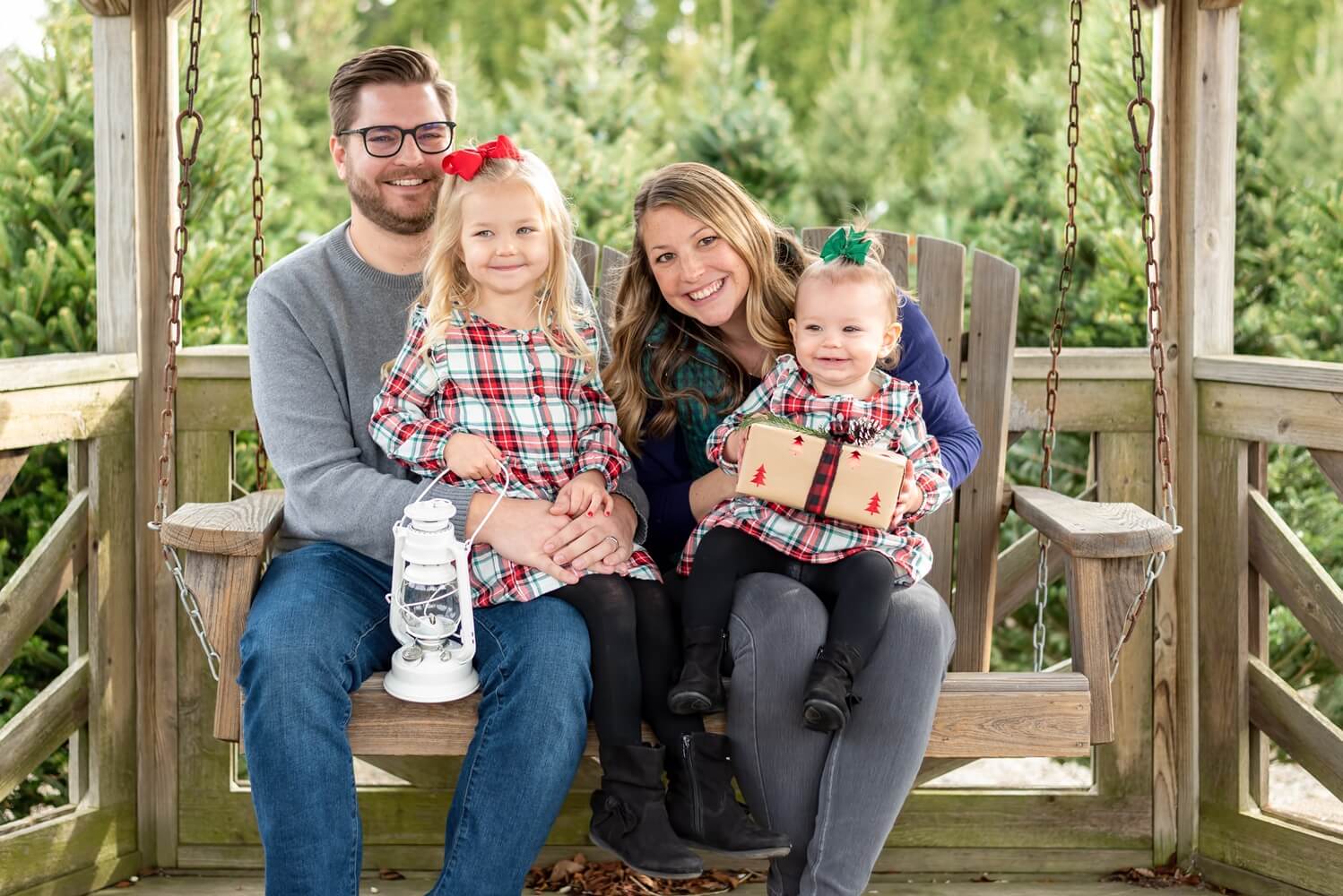 Cute young couple with two little girls