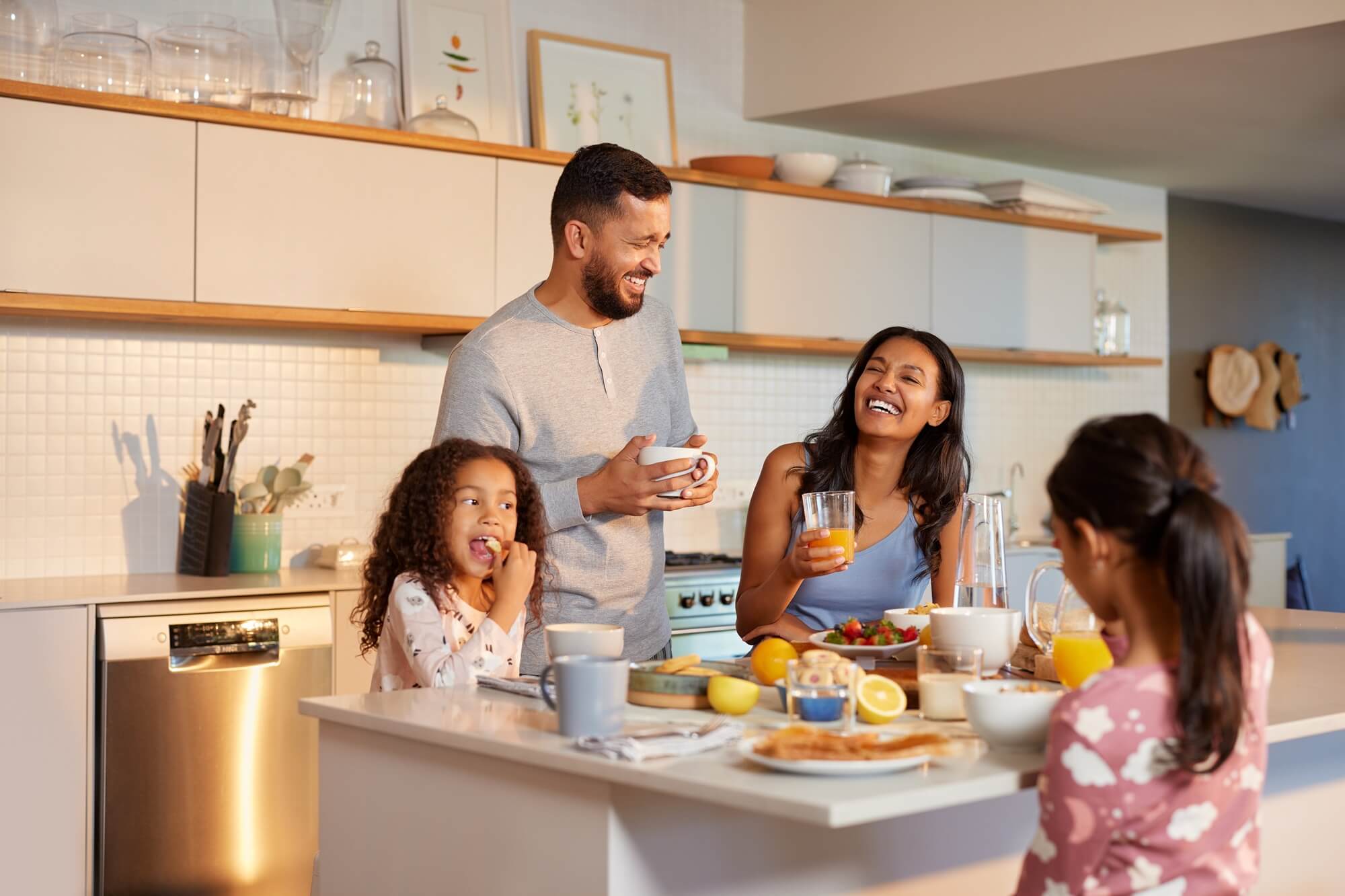 family enjoy a cheerful breakfast together
