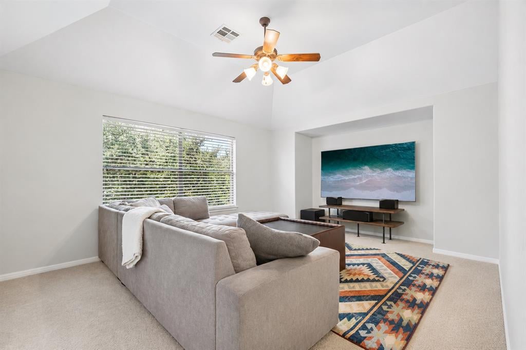 Upstairs game room with vaulted ceiling at 8008 Ladera Verde Dr in Circle C Ranch
