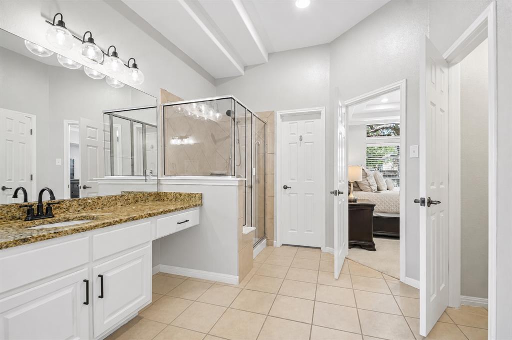 Primary bath walk-in shower and updated lighting at 8008 Ladera Verde Dr, Austin