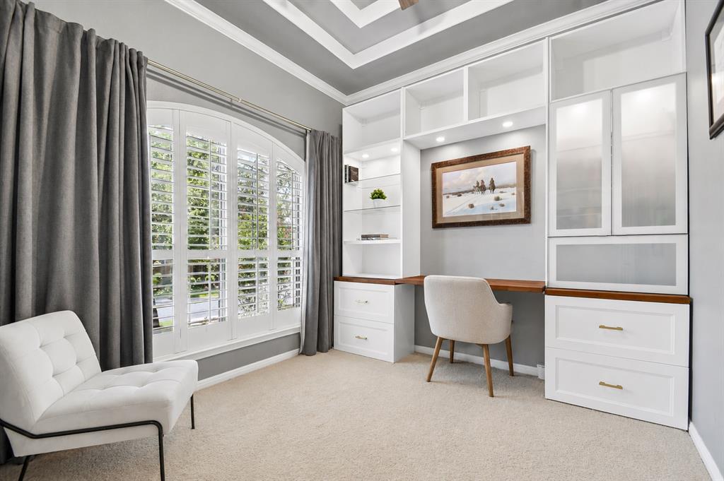 Home office with custom built-in cabinetry and desk at 8008 Ladera Verde Dr, Circle C Austin
