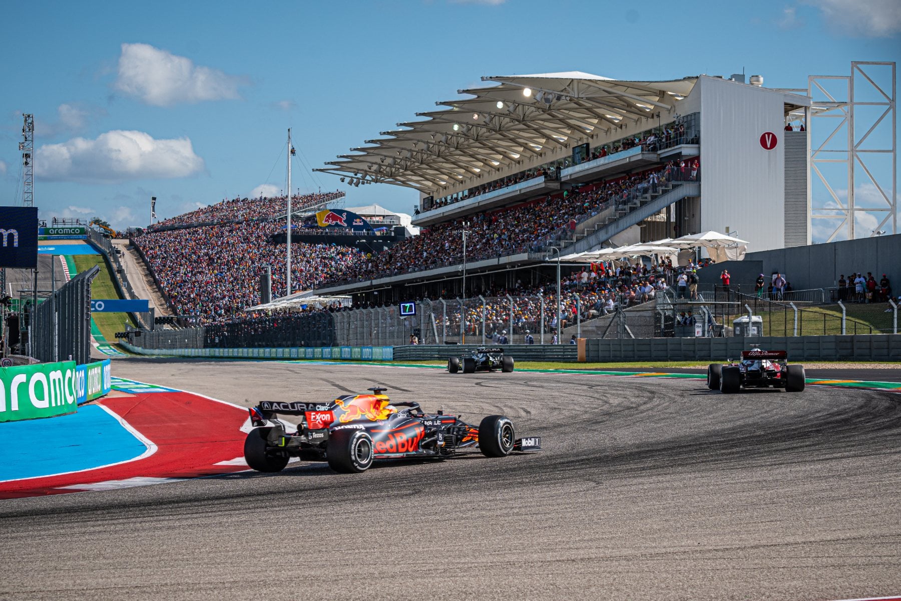 Formula 1 car racing past the main grandstand at Circuit of The Americas in Austin