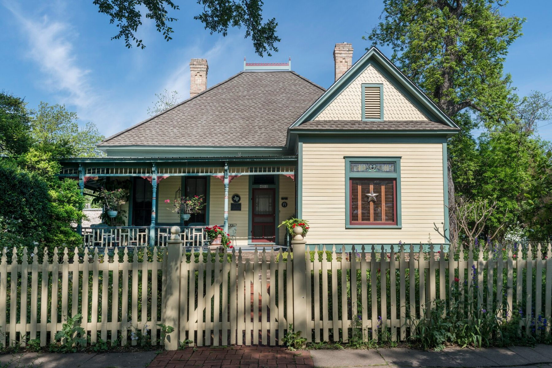 Historic cottage in the Hyde Park neighborhood of Austin, Texas, with a Texas star in the window