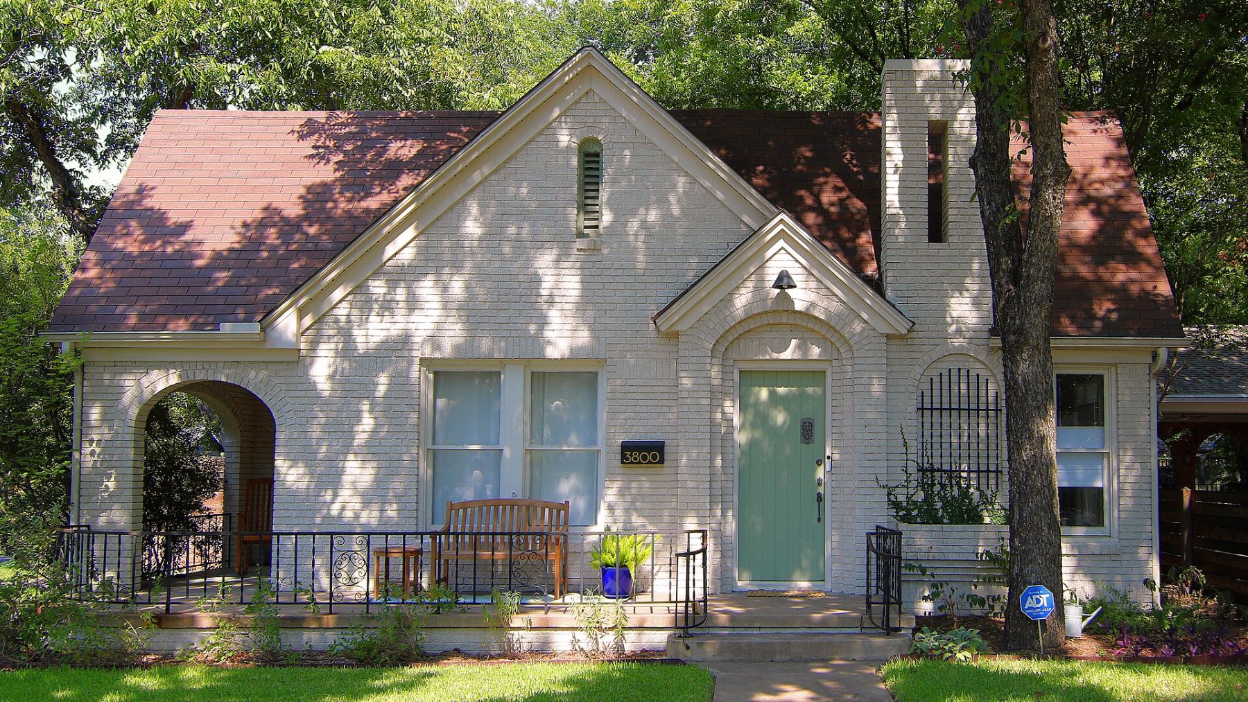 White brick Tudor-style home on Avenue H in Hyde Park, Austin