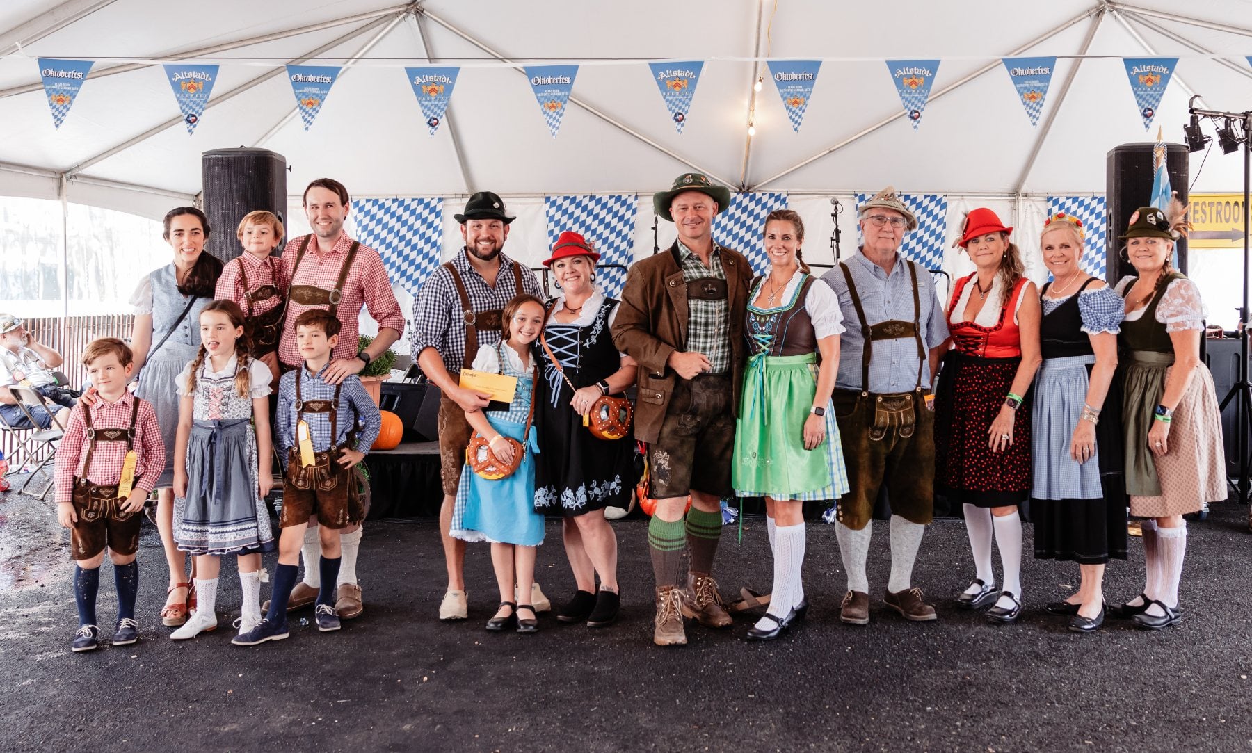 Costumed guests under the festival tent at Oktoberfest in Fredericksburg, Texas