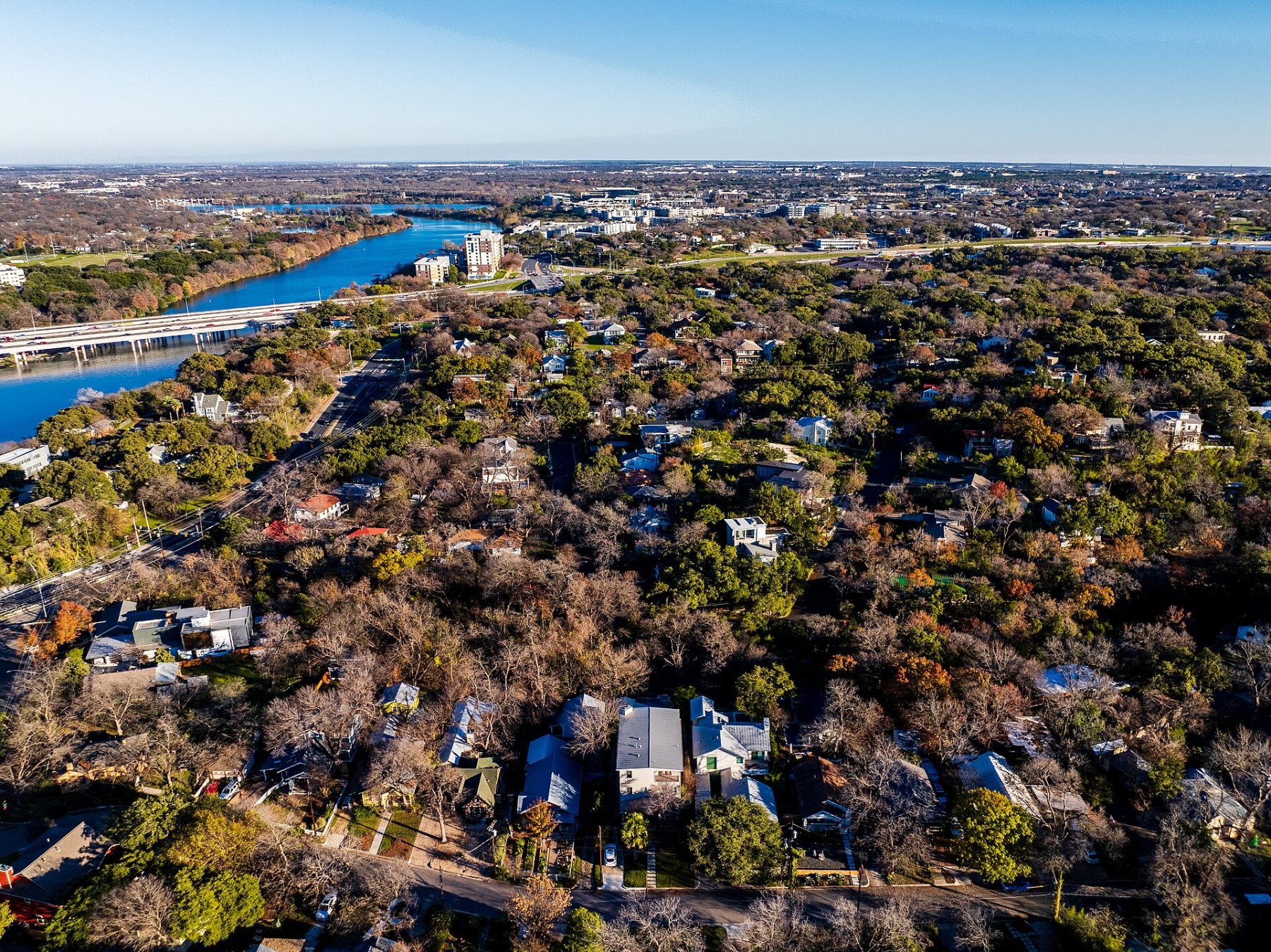 Aerial view of Travis Heights homes and Lady Bird Lake in Austin