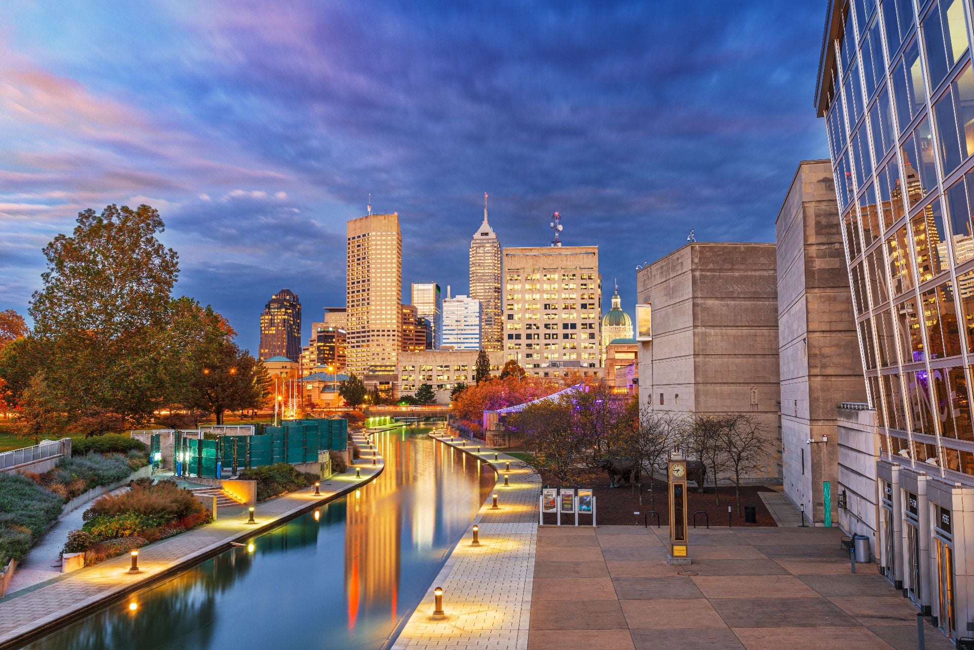 Indianapolis, Indiana, USA downtown cityscape over the river walk at twilight.