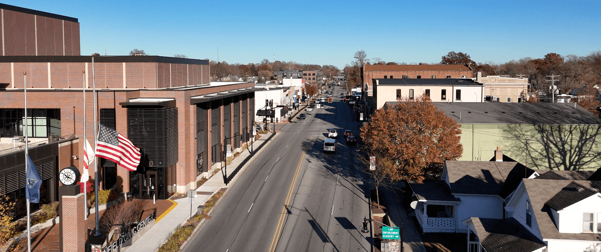 Aerial view of downtown Plainfield, Indiana, showing the civic center, main road, and surrounding neighborhood.